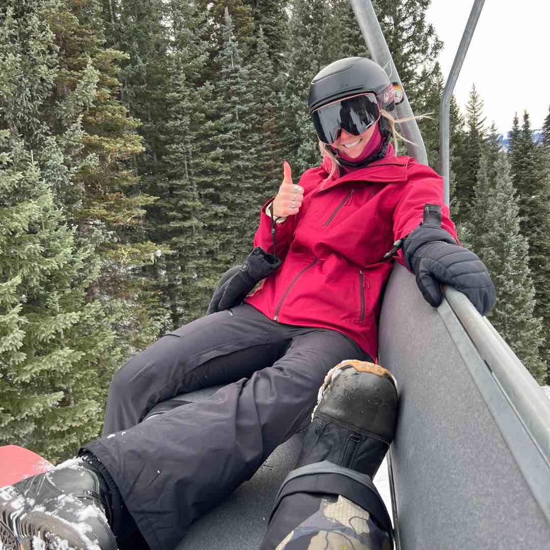 Jessica smiling on a ski lift.