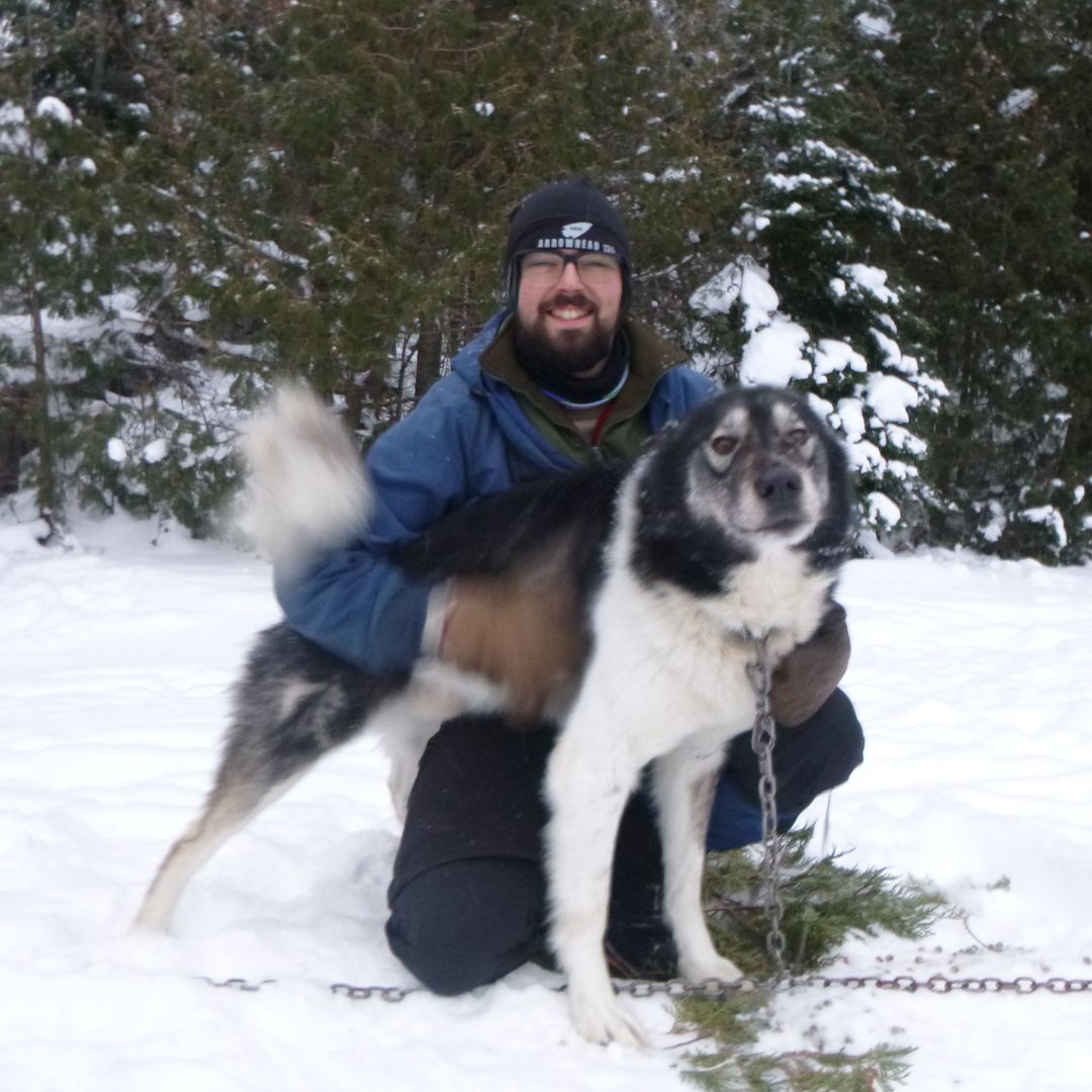 Alec posing with his dog